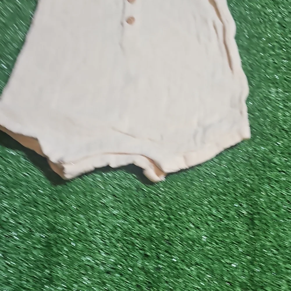 Cream Sleeveless Baby Romper